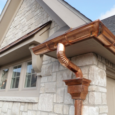 Beautiful copper rain gutters. Installing rain gutters to fit the style of your home. Rain gutter maintenance. Rain gutters on a house. Gutter and downspout maintenance.