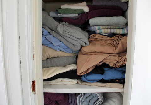 Organized linen closet. How to go from stuffed to simple