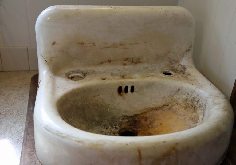 dirty cast iron sink