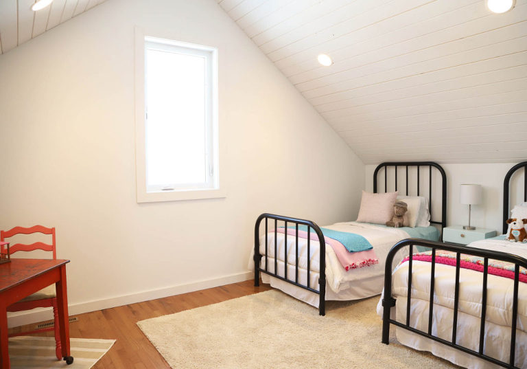 shared girls room with sloped ceiling